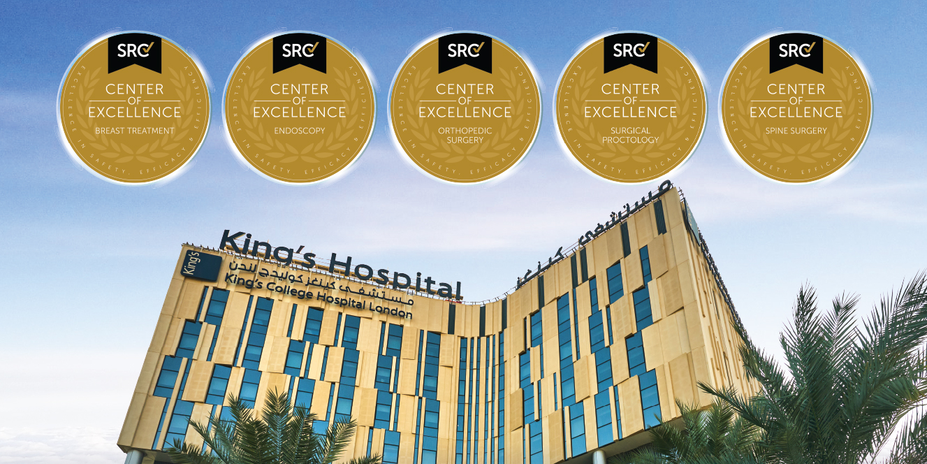 King's Hospital London building with five SRC Center of Excellence gold badges in the blue sky above it.